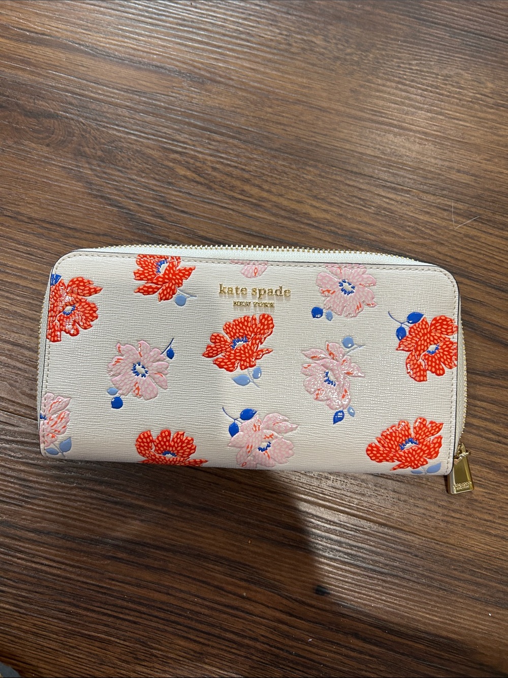kate spade cream floral zip-around wallet with red and pink blooms